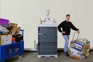 HSM V-Press 503 eco baler with a tied cardboard bale on the discharge trolley