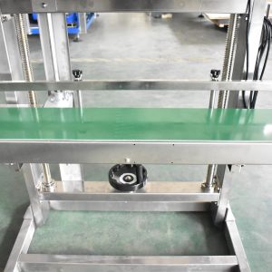 AS600F band sealer: the conveyor table and the handwheel that sets its height